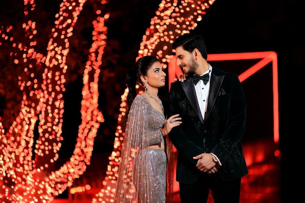 Jaideep Gandhi Wedding Photography - Black-tie couple under glowing bokeh lights